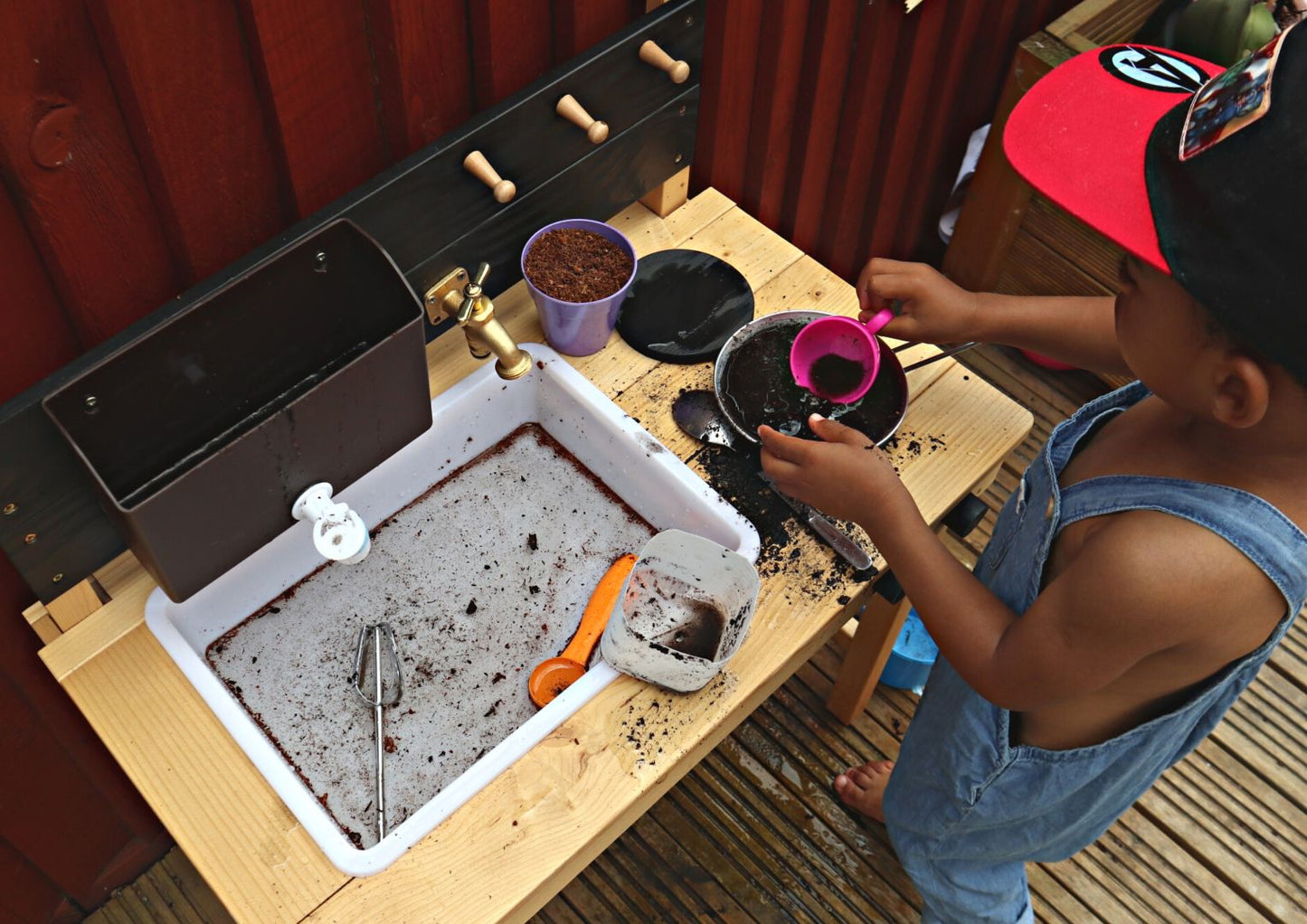 Creative play in a mud kitchen