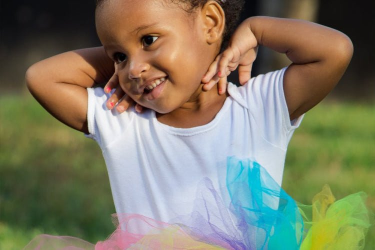 child playing rainbow ball run